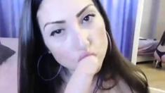 Hot babe loves sucking a dildo on webcam