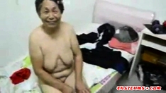 Asian Grandma get dressed after sex